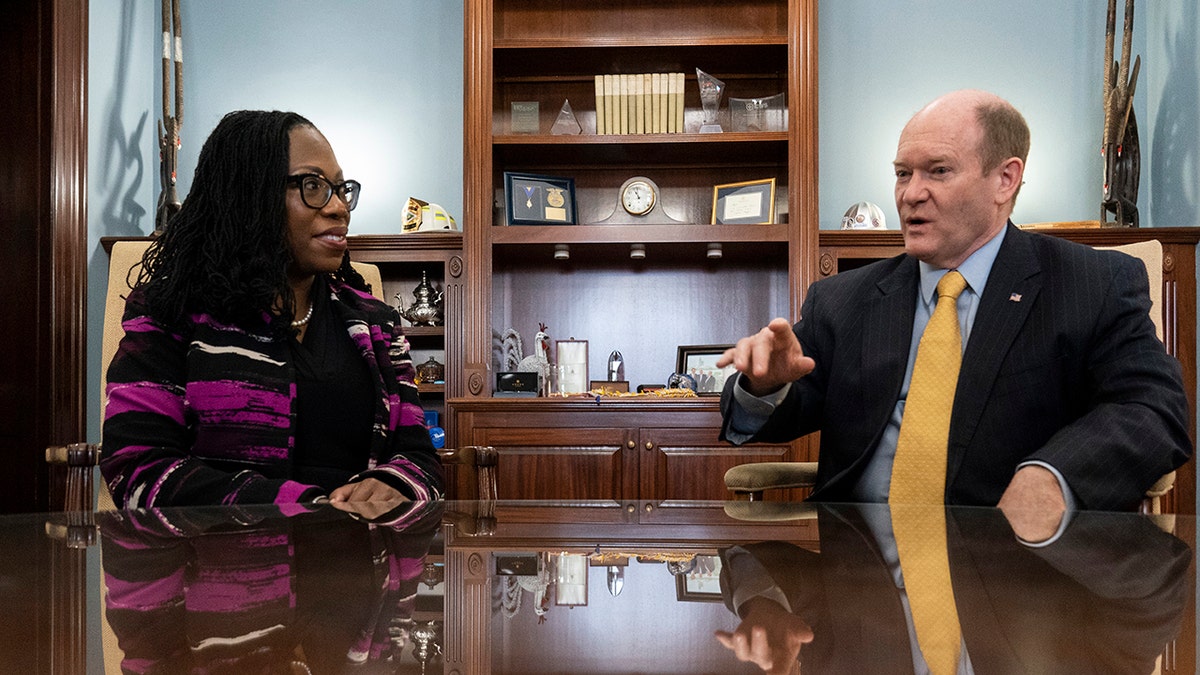 Judge Ketanji Brown Jackson meets with Sen. Chris Coons, D-Del., on Capitol Hill, Wednesday, March 10, 2022, in Washington. 