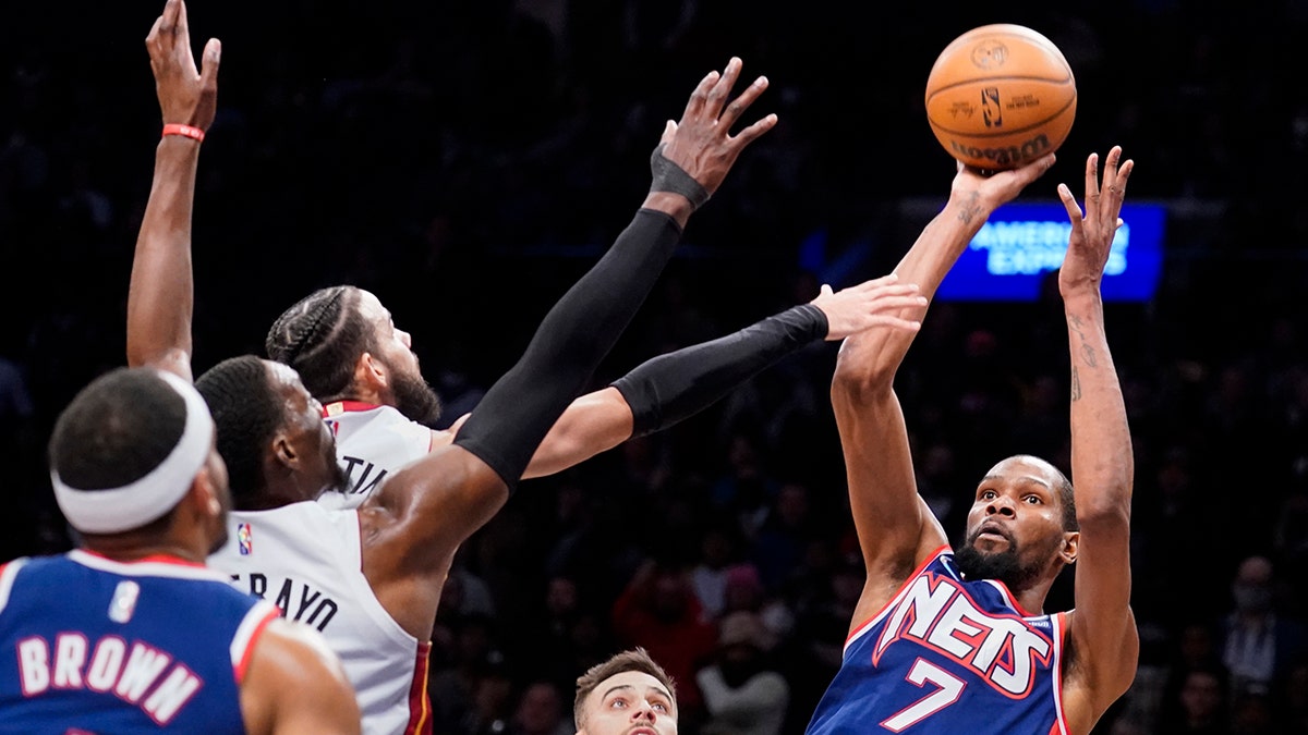 Brooklyn Nets forward Kevin Durant (7) takes a shot in the final seconds of the second half of an NBA basketball game against the Miami Heat, Thursday, March 3, 2022, in New York.