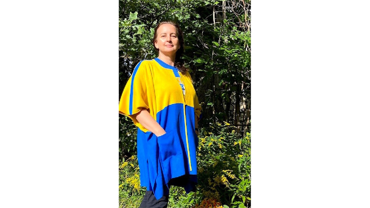 Lana Riggins, a Ukraine-born knitwear designer, is selling blue-and-yellow varsity sweater jackets to benefit a local charity that’s supporting Ukraine.