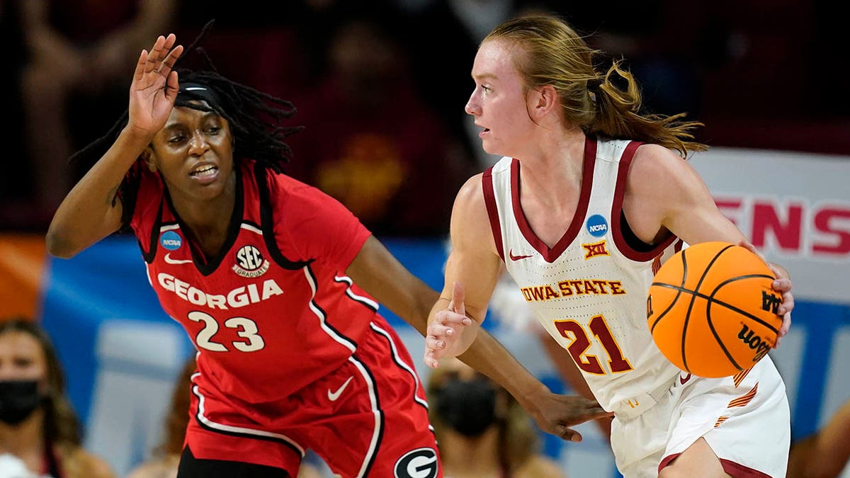Iowa State guard Lexi Donarski (21) drives past Georgia guard Que Morrison (23) during the first half of a second-round game in the NCAA women's college basketball tournament, Sunday, March 20, 2022, in Ames, Iowa. 