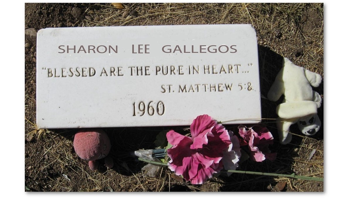 A grave marker identified the plot as that of Sharon Gallegos.?