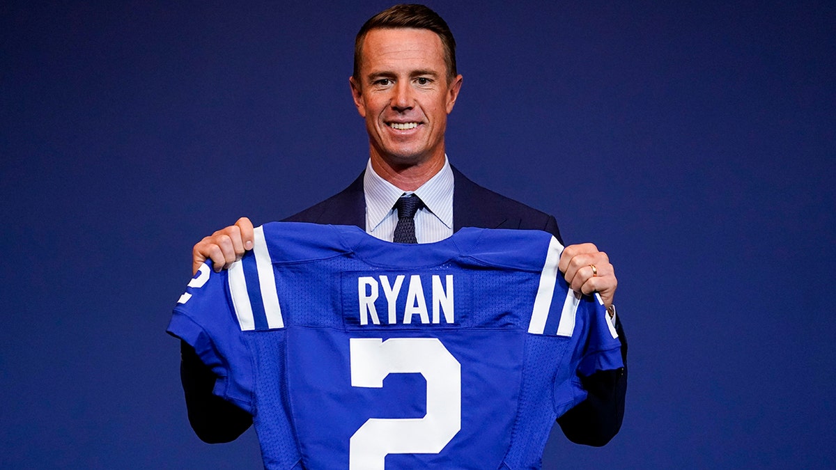 Indianapolis Colts quarterback Matt Ryan holds his new jersey following a press conference at the NFL team's practice facility in Indianapolis, Tuesday, March 22, 2022.