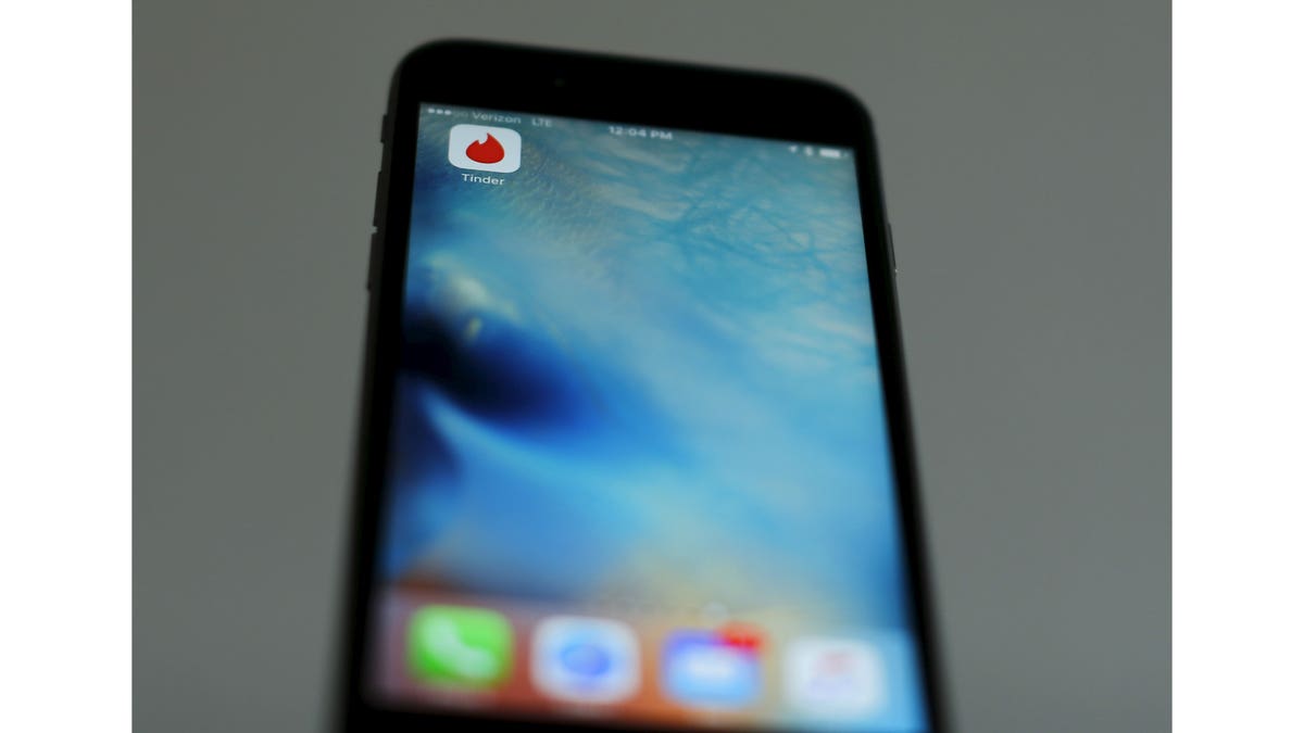 The dating app Tinder is shown on an Apple iPhone