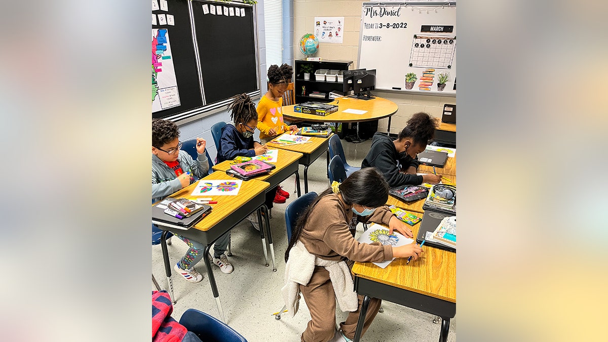 Third-grade students at Oak Hill Elementary School are pictured creating Ukraine-inspired art to express support for the war-ravaged country.