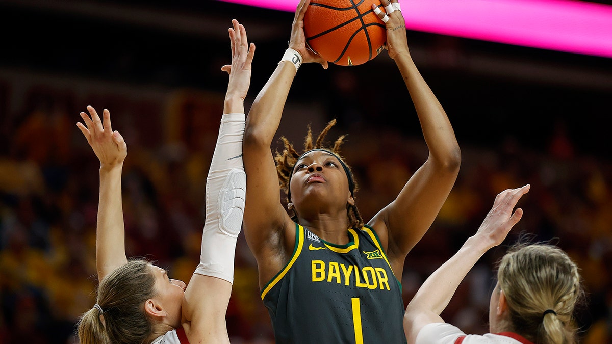 Baylor forward NaLyssa Smith (1) shoots over Iowa State guard Ashley Joens (24) and forward Morgan Kane (31) during the first half of an NCAA college basketball game Monday, Feb. 28, 2022, in Ames, Iowa.
