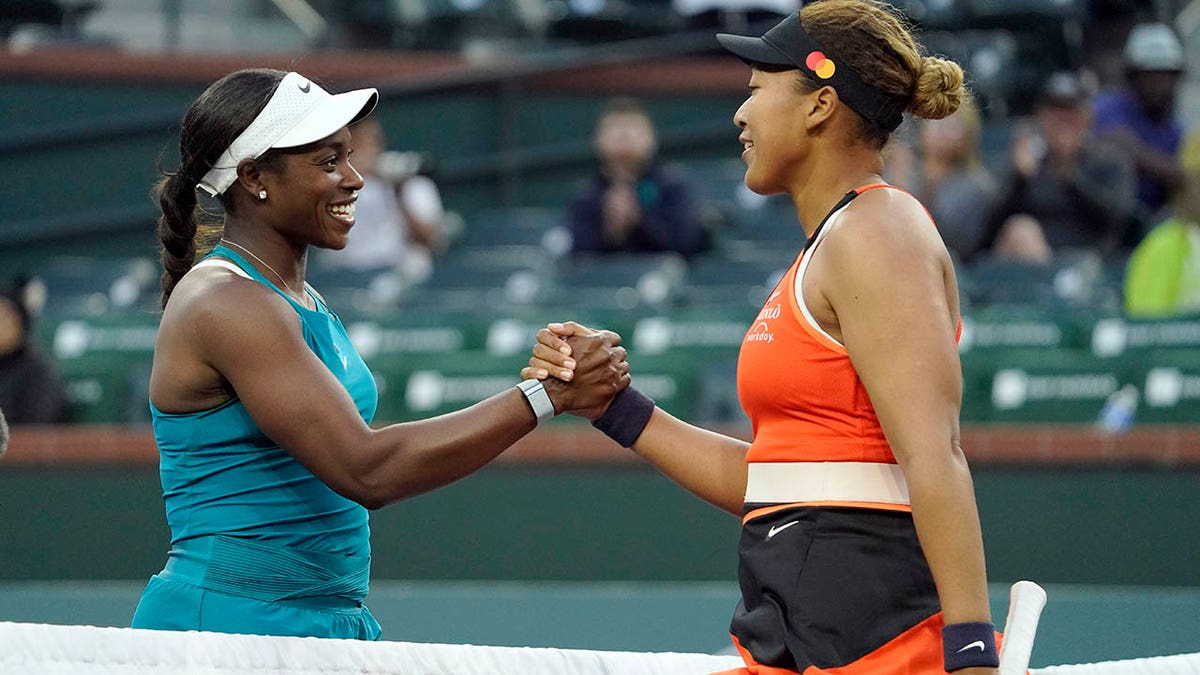 Naomi Osaka, of Japan, right, shakes hands with Sloane Stephens after defeating her at the BNP Paribas Open tennis tournament Thursday, March 10, 2022, in Indian Wells, Calif.