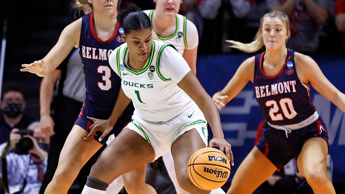 Oregon forward Nyara Sabally (1) works to shoot against Belmont forward Madison Bartley (3) during the first half of a college basketball game in the first round of the NCAA tournament, Saturday, March 19, 2022, in Knoxville, Tenn.