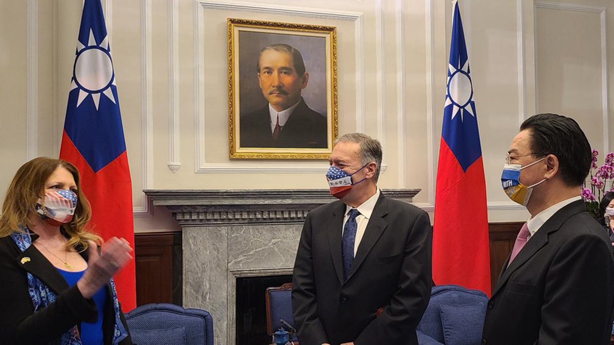 Susan Pompeo makes a point as former Secretary of State Mike Pompeo, center, and Taiwanese Foreign Minister Joseph Wu listen during the Pompeos' visit to Taipei, March 3, 2022. (Mike Pompeo Twitter)