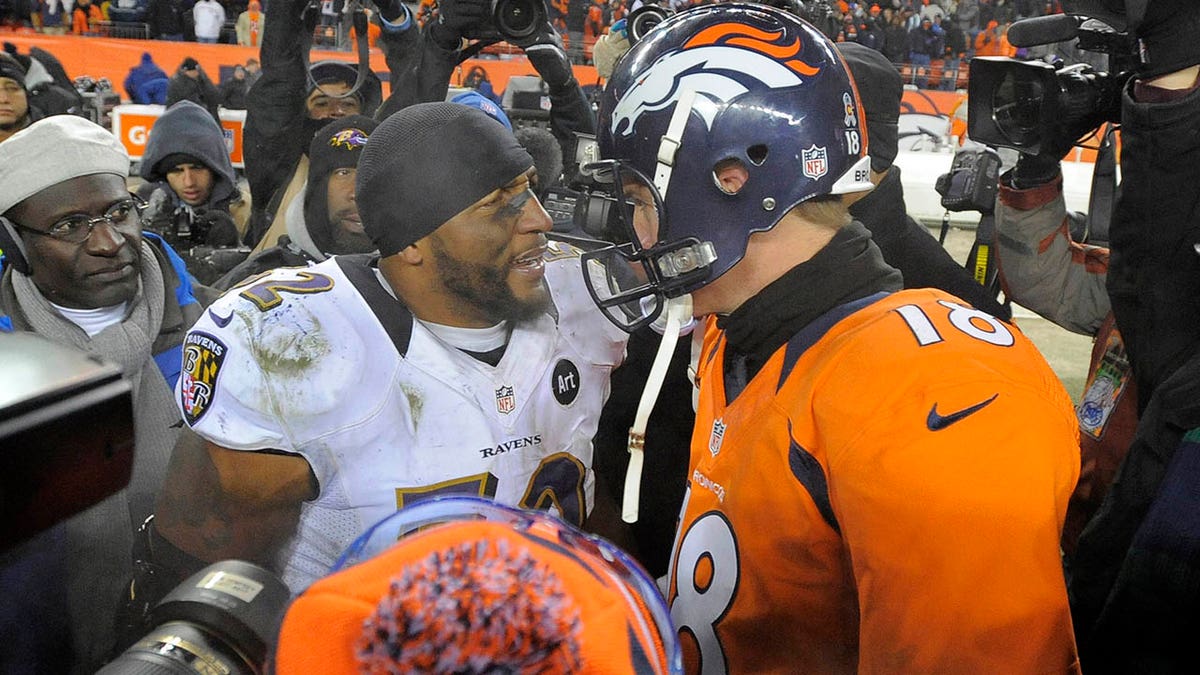 Baltimore Ravens linebacker Ray Lewis is greeted by Denver Broncos quarterback Peyton Manning after the AFC Divisonal Playoff at Sports Authority Field at Mile High in Denver, Colorado, on Saturday, January 12, 2013. The Ravens won in OT, 38-35.