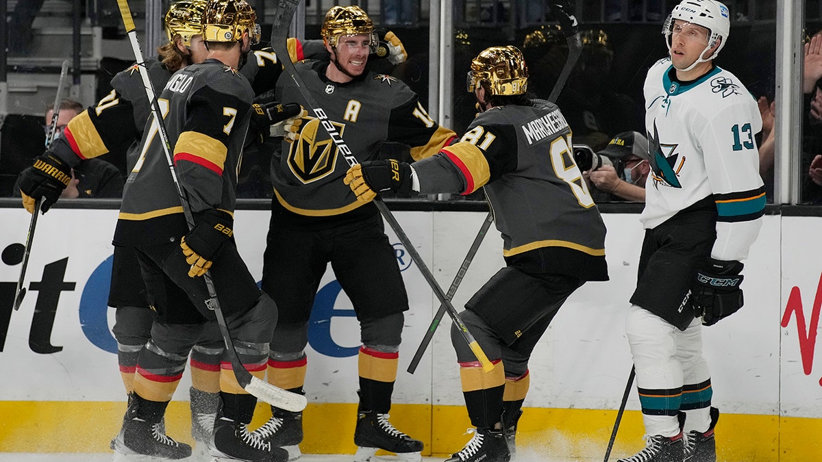 Vegas Golden Knights right wing Reilly Smith, center, celebrates after scoring against the San Jose Sharks during the second period of an NHL hockey game Tuesday, March 1, 2022, in Las Vegas.