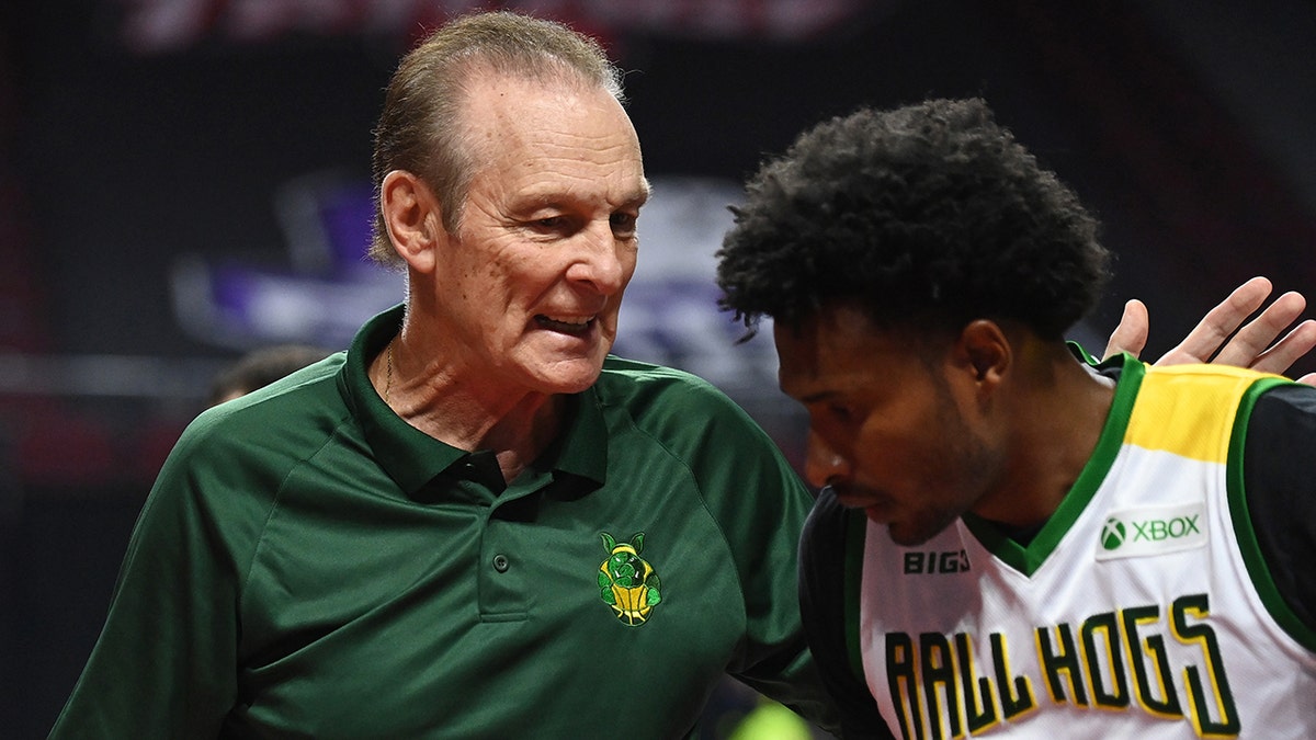Head coach Rick Barry of Ball Hogs talks with Leonardo Barbosa #19 during a BIG3 game against Power in Week Eight at the Orleans Arena on August 21, 2021 in Las Vegas, Nevada.