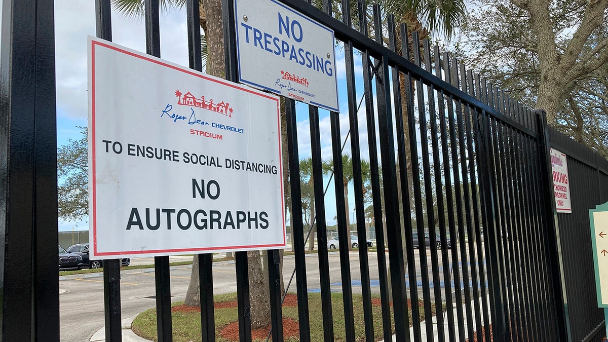 Signs are posted outside Roger Dean Stadium in Jupiter, Florida, Monday, Feb. 21, 2022.