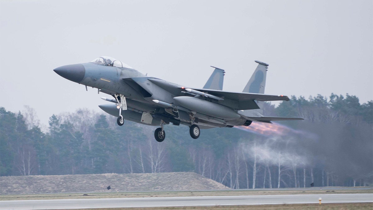 In this image provided by the U.S. Air Force, a U.S. Air Force F-15C Eagle assigned to the 493rd Fighter Squadron, Royal Air Force (RAF) Lakenheath, takes off in support of North Atlantic Treaty Organization enhanced air policing missions with the Polish Air Force at Lask Air Base, Poland, Feb. 15, 2022. (Tech. Sgt. Jacob Albers/U.S. Air Force via AP)