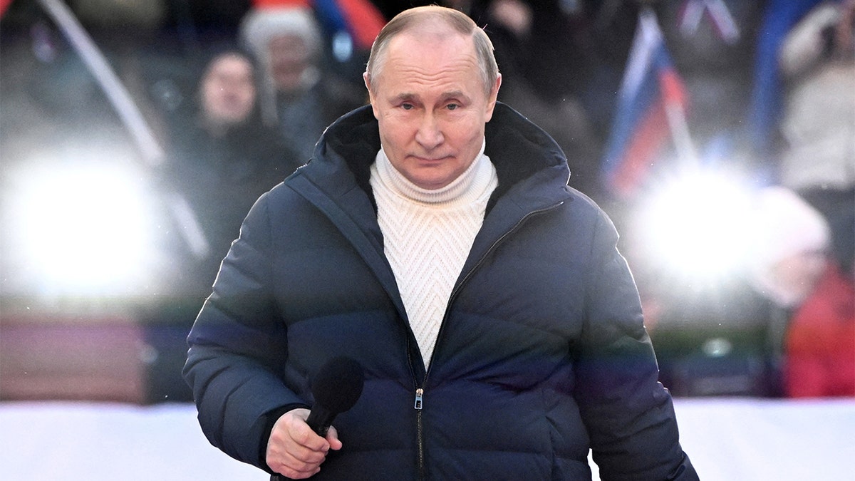 Russian President Vladimir Putin delivers a speech during a concert marking the eighth anniversary of Russia's annexation of Crimea at Luzhniki Stadium in Moscow, March 18, 2022. Sputnik/Sergey Guneev/Kremlin via REUTERS