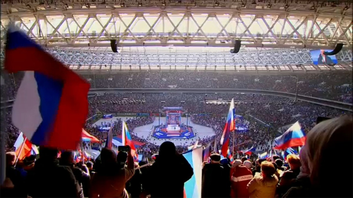 Russian President Vladimir Putin delivers a speech during a concert marking the eighth anniversary of Russia's annexation of Crimea at Luzhniki Stadium in Moscow, March 18, 2022.