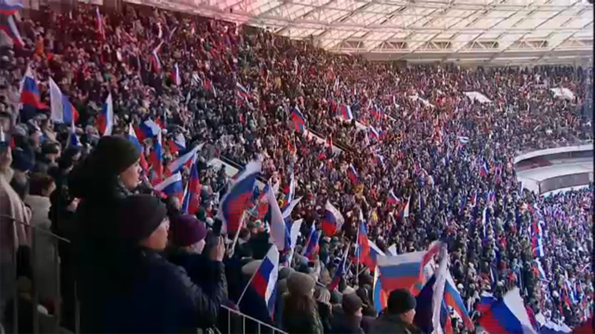 Russian President Vladimir Putin delivers a speech during a concert marking the eighth anniversary of Russia's annexation of Crimea at Luzhniki Stadium in Moscow, March 18, 2022.