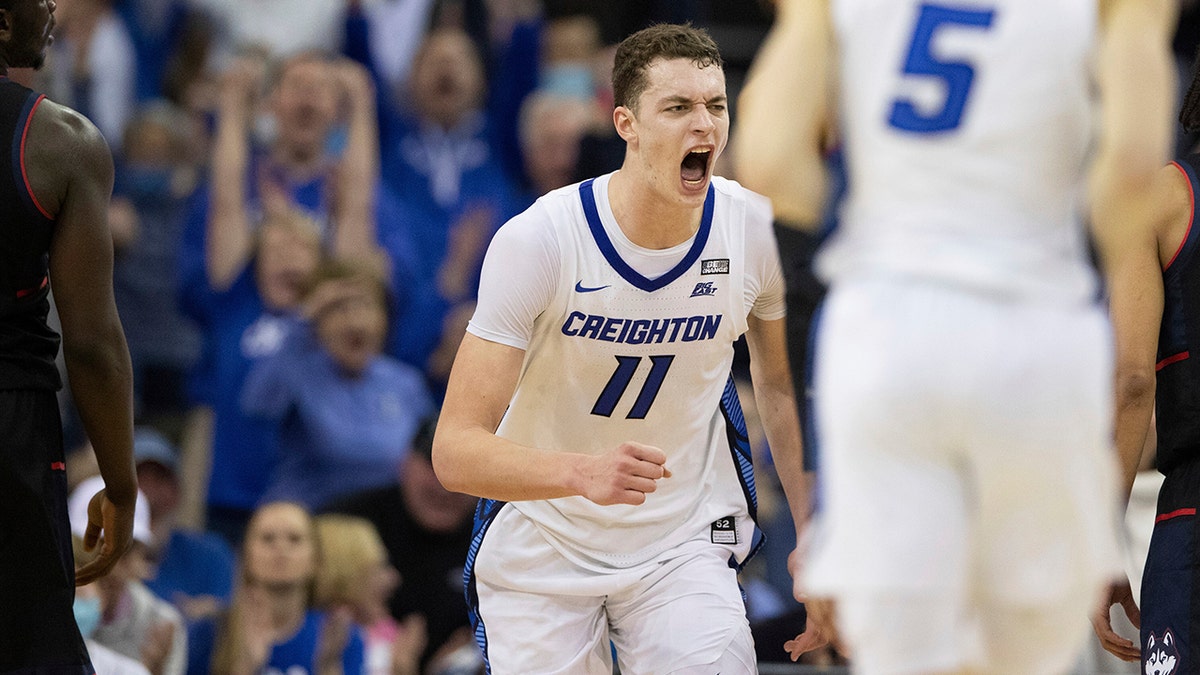 Creighton's Ryan Kalkbrenner (11) celebrates after scoring against Connecticut during the second half of an NCAA college basketball game Wednesday, March 2, 2022, in Omaha, Neb.