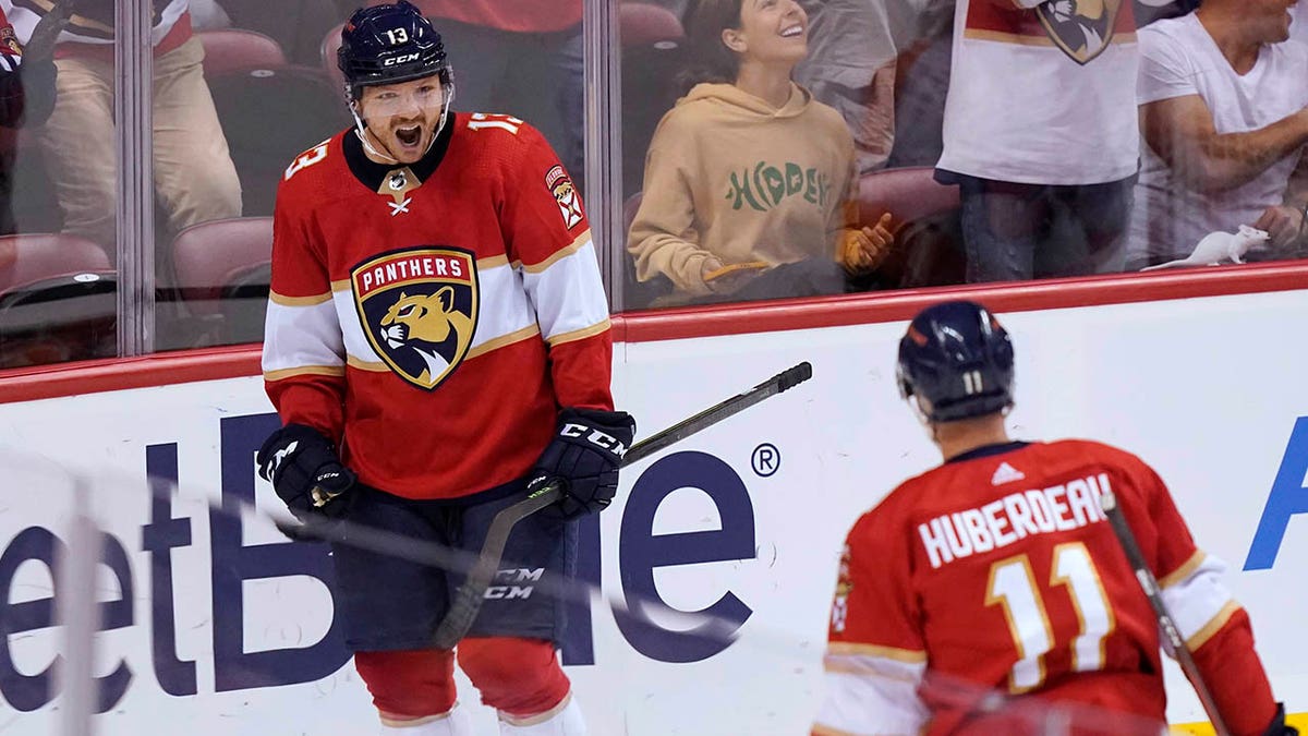 Florida Panthers center Sam Reinhart (13) celebrates his goal, assisted by left wing Jonathan Huberdeau (11), during the first period of the team's NHL hockey game against the Philadelphia Flyers, Thursday, March 10, 2022, in Sunrise, Fla.