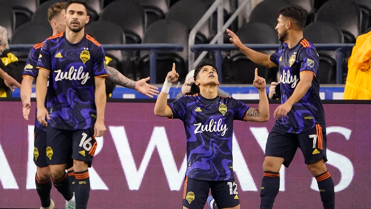 Seattle Sounders forward Fredy Montero, center, kneels after he scored his second goal against Club Leon during the first half of a CONCACAF Champions League soccer match, Tuesday, March 8, 2022, in Seattle.