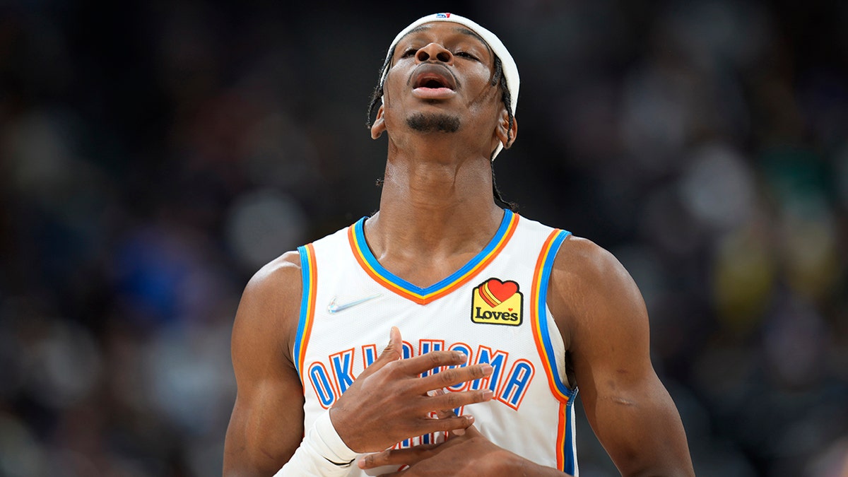 Oklahoma City Thunder guard Shai Gilgeous-Alexander catches his breath after hitting a basket against the Denver Nuggets during the second half of an NBA basketball game Wednesday, March 2, 2022, in Denver. The Thunder won 119-107.