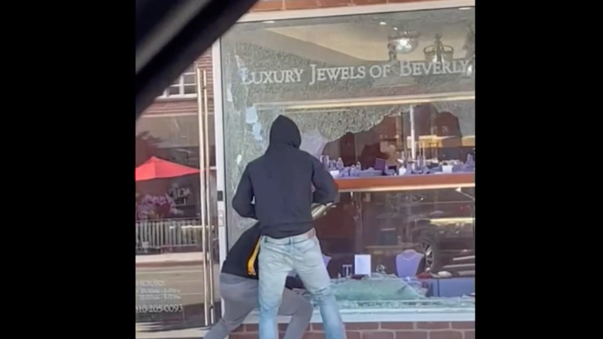 Photo shows a smashed window at a jewelry store in California that was targeted by smash-and-grab suspects