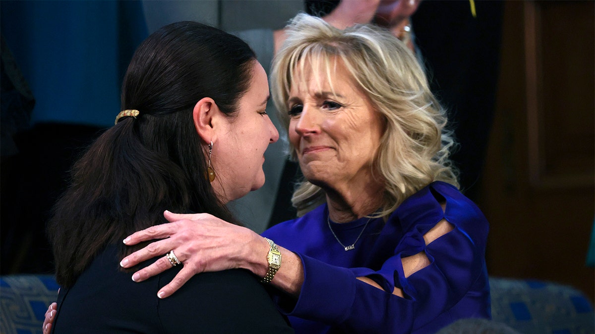 First lady Jill Biden greets her guest Ukraine Ambassador to the United States, Oksana Markarova as Markarova arrives in the first lady's box in the chamber of the House of Representatives before the State of the Union address by President Joe Biden to a joint session of Congress at the Capitol, Tuesday, March 1, 2022, in Washington. (Evelyn Hockstein/Pool via AP)