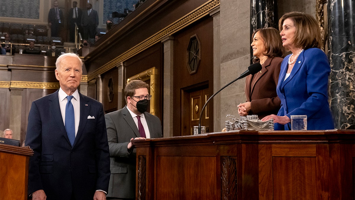 President Joe Biden arrives to deliver his first State of the Union address to a joint session of Congress at the Capitol, Tuesday, March 1, 2022, in Washington, as Vice President Kamala Harris and Speaker of the House Nancy Pelosi of Calif., look on. (Saul Loeb, Pool via AP)