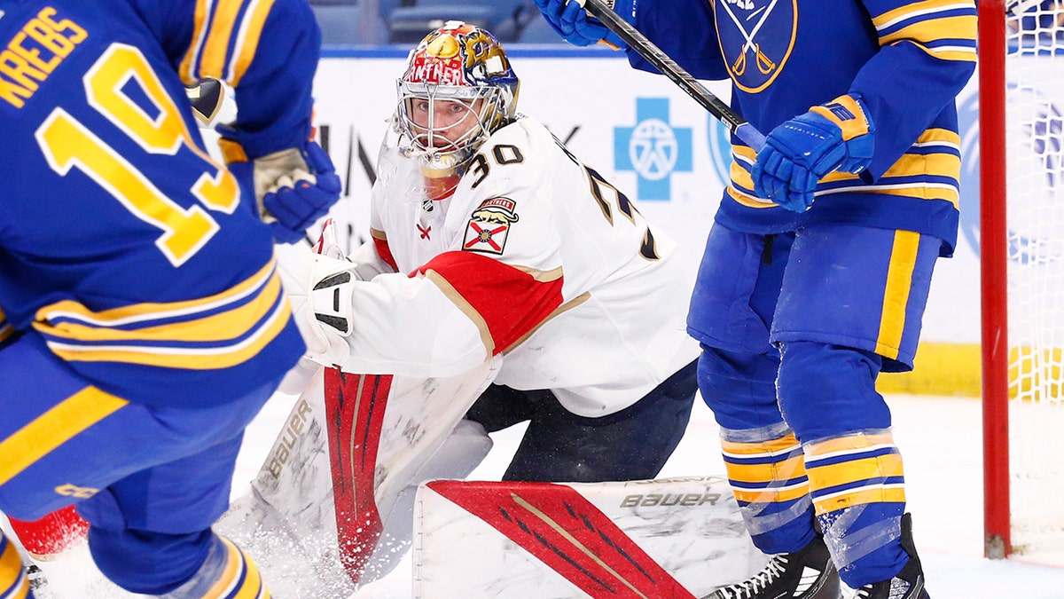 Florida Panthers goaltender Spencer Knight (30) looks for the puck in traffic during the first period of an NHL hockey game against the Buffalo Sabres, Monday, March 7, 2022, in Buffalo, N.Y.