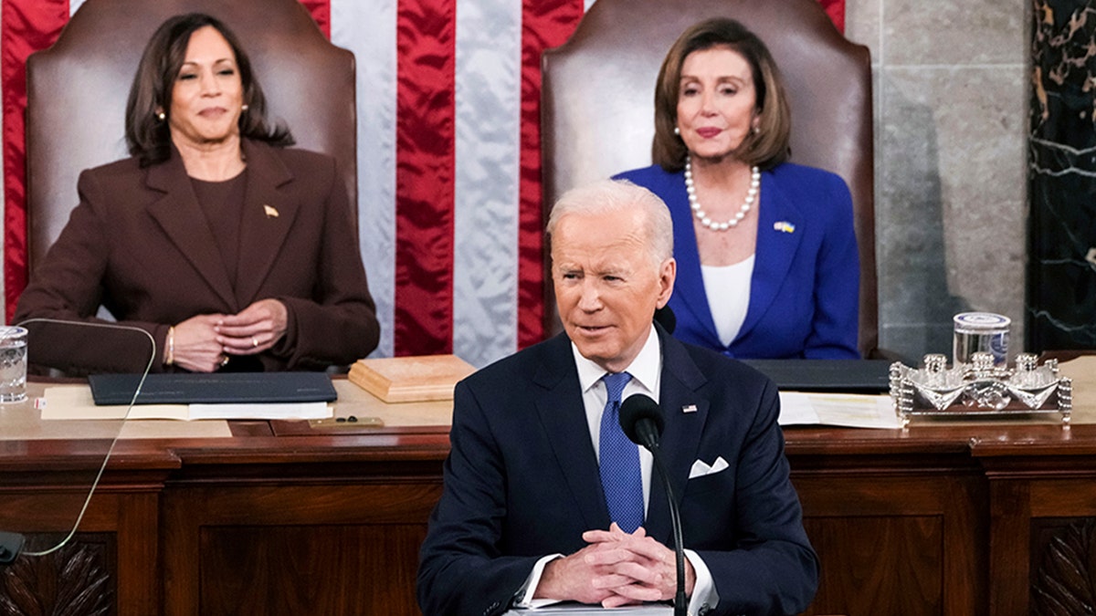 President Joe Biden delivers his first State of the Union address to a joint session of Congress at the Capitol, Tuesday, March 1, 2022, in Washington, as Vice President Kamala Harris and Speaker of the House Nancy Pelosi of Calif., look on. (Sarahbeth Maney/The New York Times via AP, Pool)