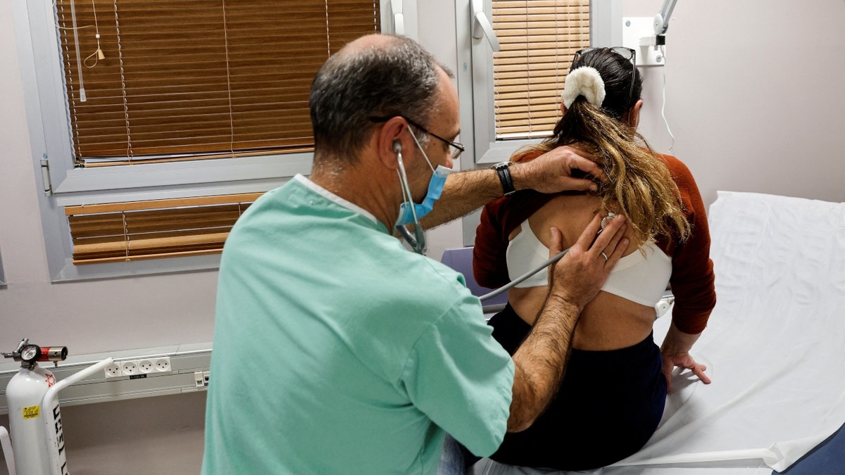 A patient suffering from Long COVID is examined in the post-coronavirus disease (COVID-19) clinic of Ichilov Hospital in Tel Aviv, Israel, February 21, 2022. Picture taken February 21, 2022.