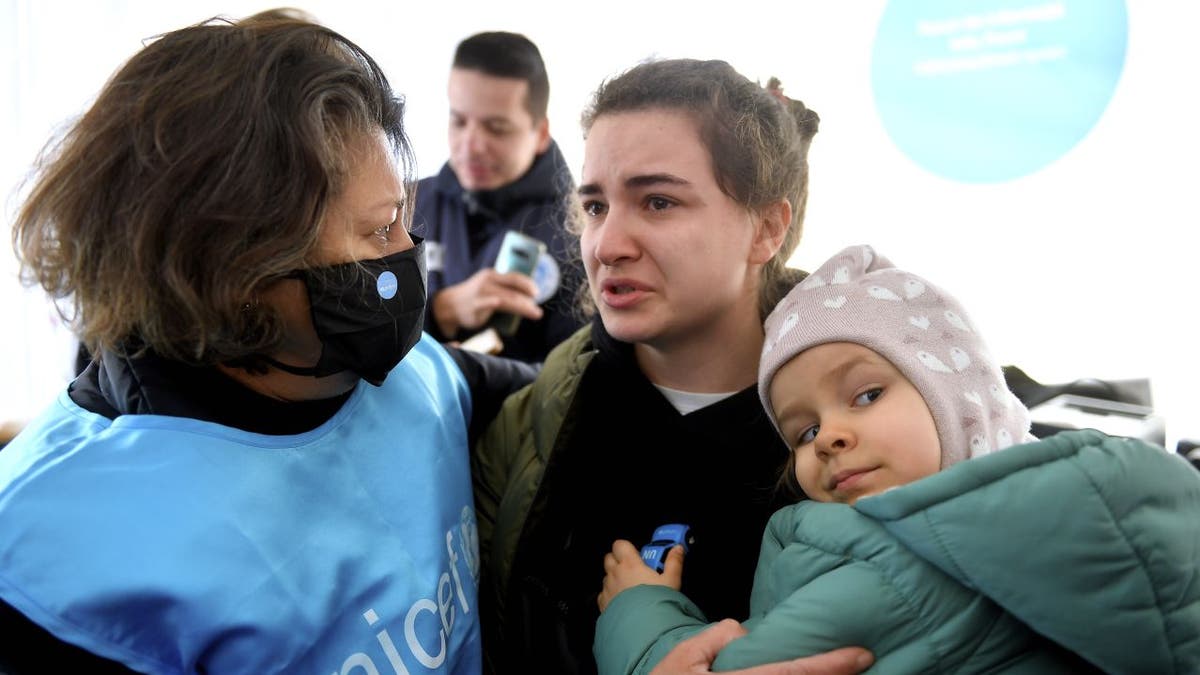 UNICEF Afhsan Khan talks with Ukraine refugees Karina and Luna