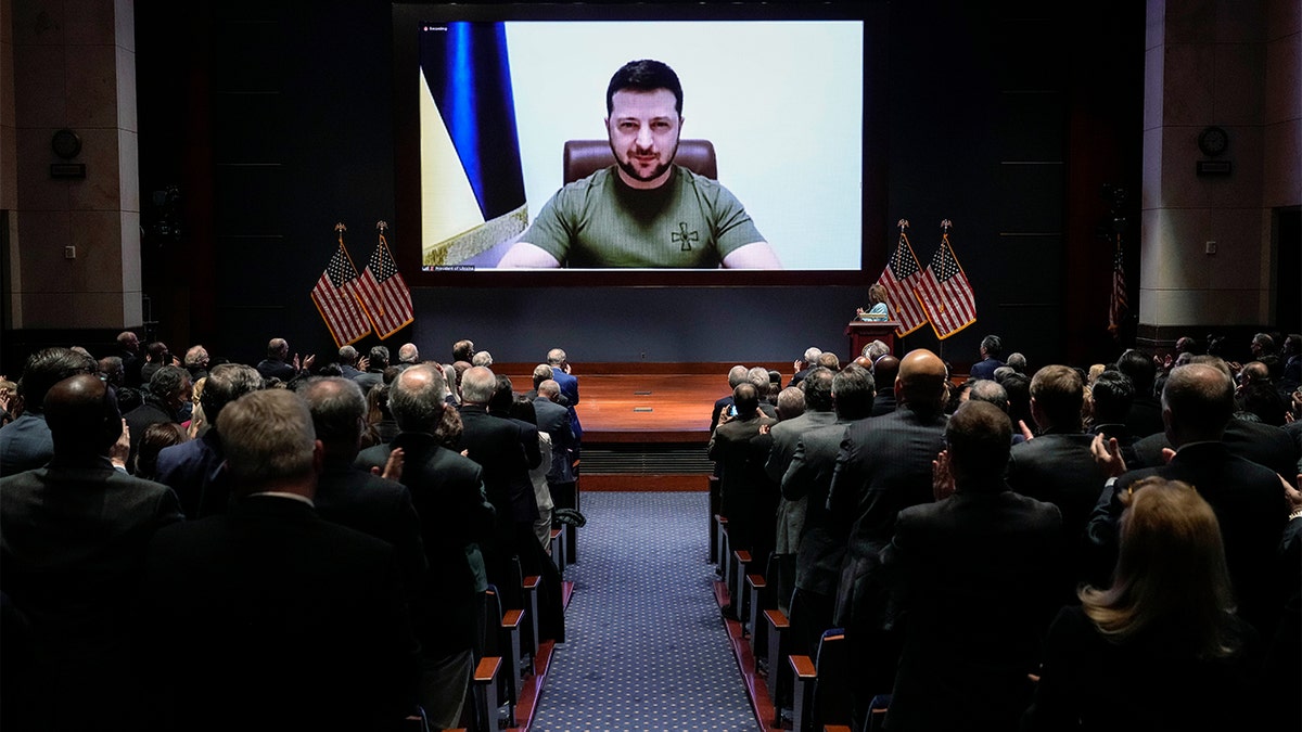 Ukrainian President Volodymyr Zelenskyy delivers a virtual address to Congress by video at the Capitol in Washington, Wednesday, March 16, 2022. (Drew Angerer, Pool via AP)