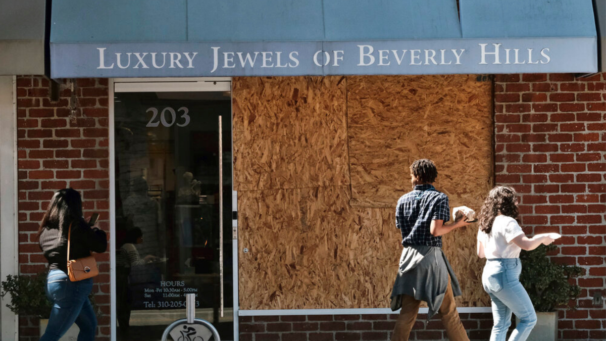 A boarded window of the Luxury Jewels of Beverly Hills