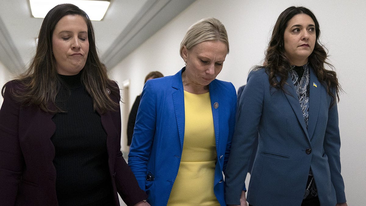 Rep. Elise Stefanik, R-N.Y., left, and Rep. Stephanie Bice, R-Okla., right, hold hands with Rep. Victoria Spartz, R-Ind., center, after the Indiana Representative, who emigrated from Ukraine, spoke about the war in Ukraine during a Republican news conference ahead of the State of the Union, Tuesday, March. 1, 2022, on Capitol Hill in Washington. (AP Photo/Jacquelyn Martin)