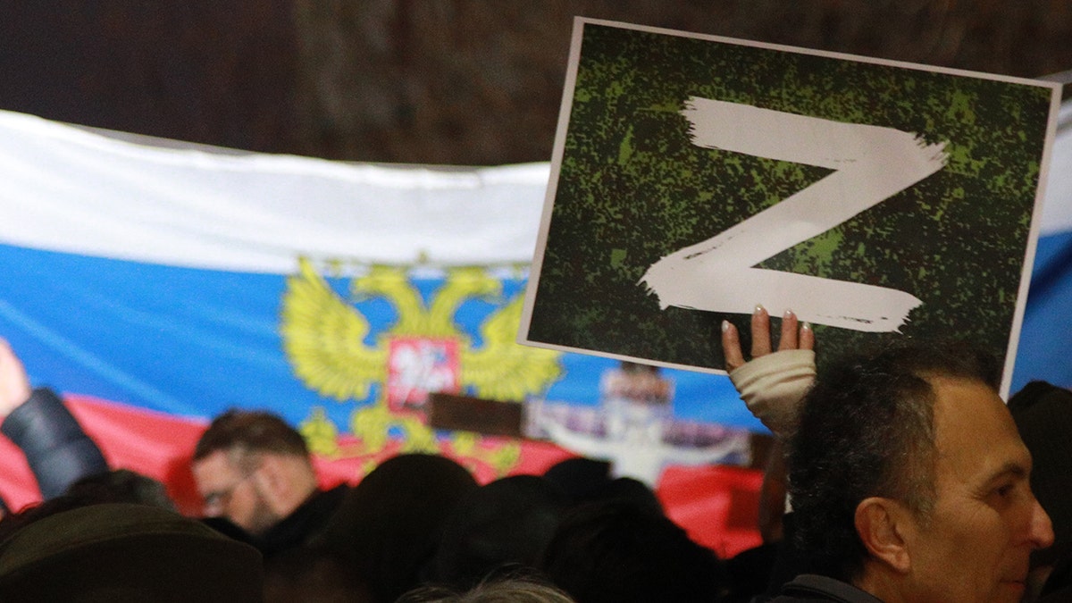 A protester holds a "Z" sign banner, in reference to Russian tanks marked with the letter, during a rally organized by Serbian right-wing organizations in support of Russian attacks on Ukraine, in Belgrade, Serbia, March 4, 2022.