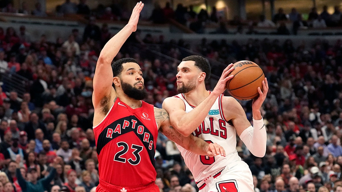 Chicago Bulls' Zach LaVine, right, drives two the basket as Toronto Raptors' Fred VanVleet defends during the second half of an NBA basketball game Monday, March 21, 2022, in Chicago. The Bulls won 113-99.