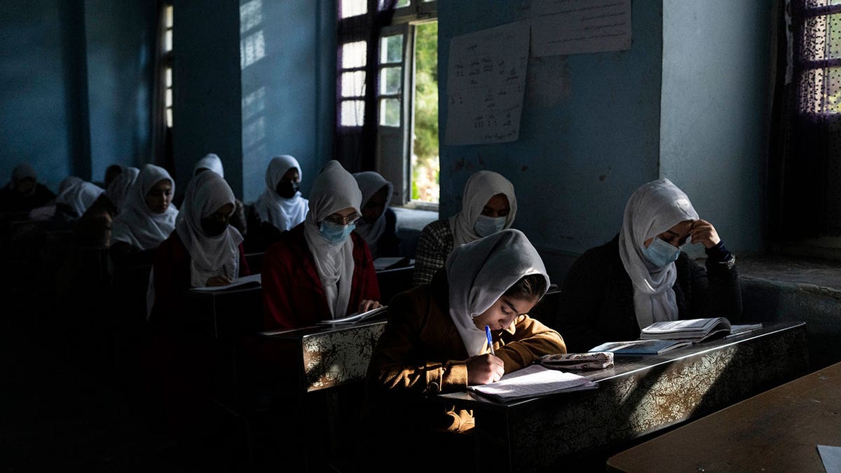 Afghan girls participate in a lesson at Tajrobawai Girls High School in Herat, Afghanistan, on Nov. 25, 2021. 