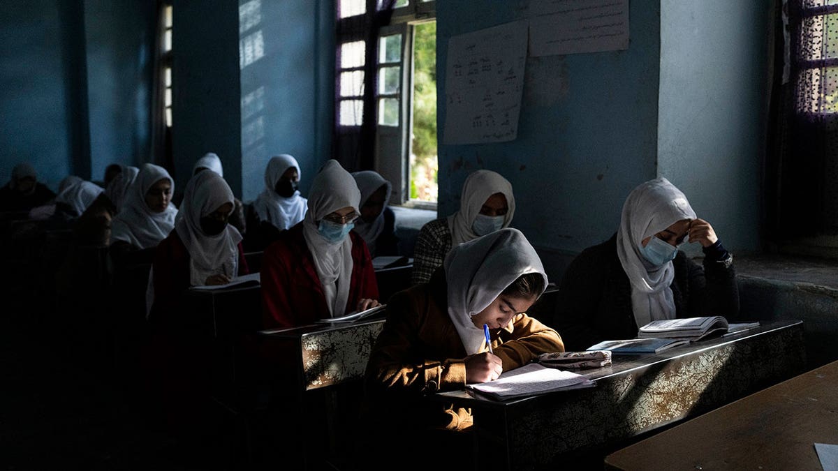 Afghan girls participate in a lesson at Tajrobawai Girls High School in Herat, Afghanistan, on Nov. 25, 2021.