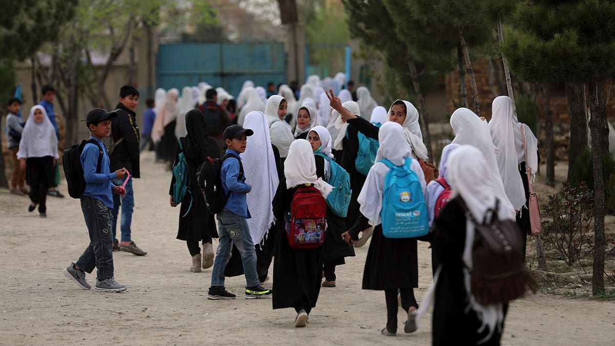 Afghan students leave school classes in a primary school in Kabul, Afghanistan on March 27, 2021. 