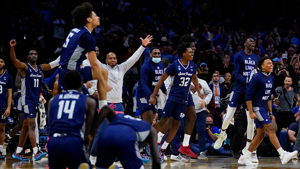 Saint Peter's celebrates after winning a college basketball game against Purdue in the Sweet 16 round of the NCAA tournament, Friday, March 25, 2022, in Philadelphia.