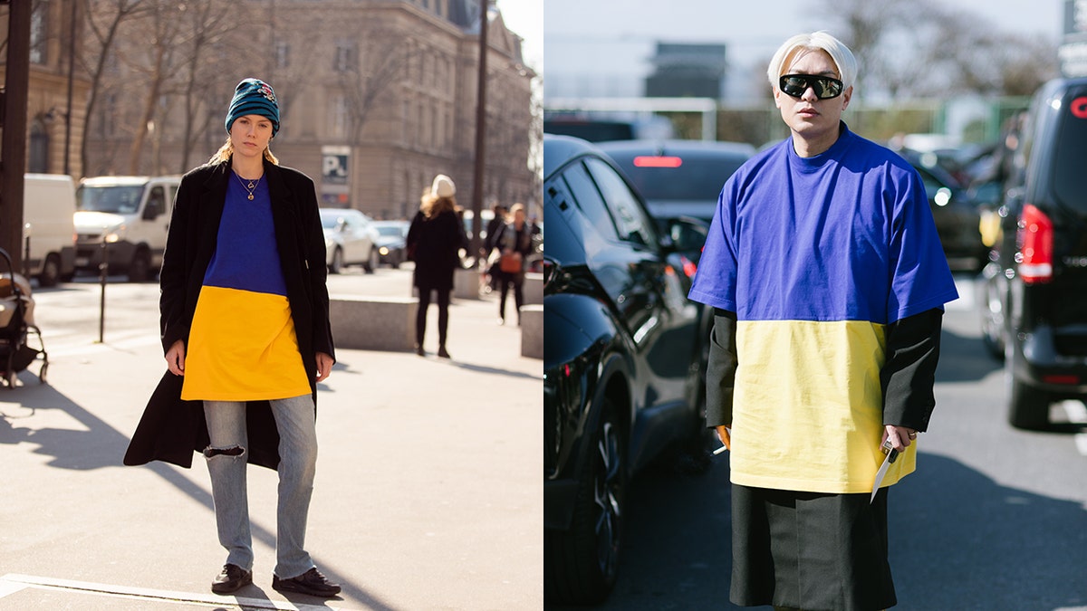 Model Kiki Willems and blogger Bryan Boy pose in Balenciaga yellow and blue Ukraine flag shirts in early March during Paris Fashion Week.