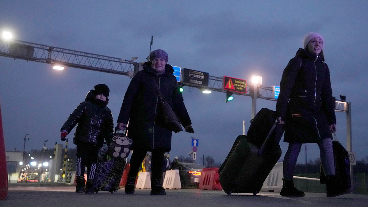 Ukrainian refugees arrive at the border crossing in Medyka, southeastern Poland, Wednesday, March 2, 2022. 