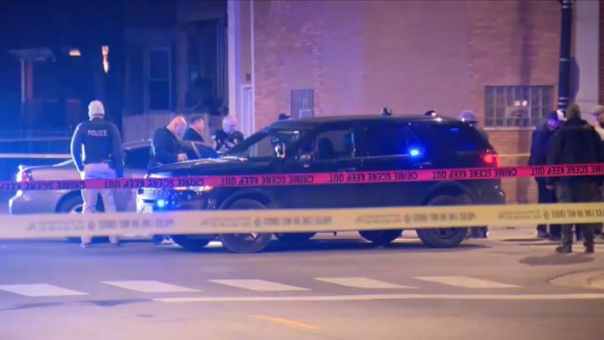 A Chicago police officer was wounded late Monday in a shootout during a traffic stop after the suspects rammed into a second officer with their vehicle, authorities said.