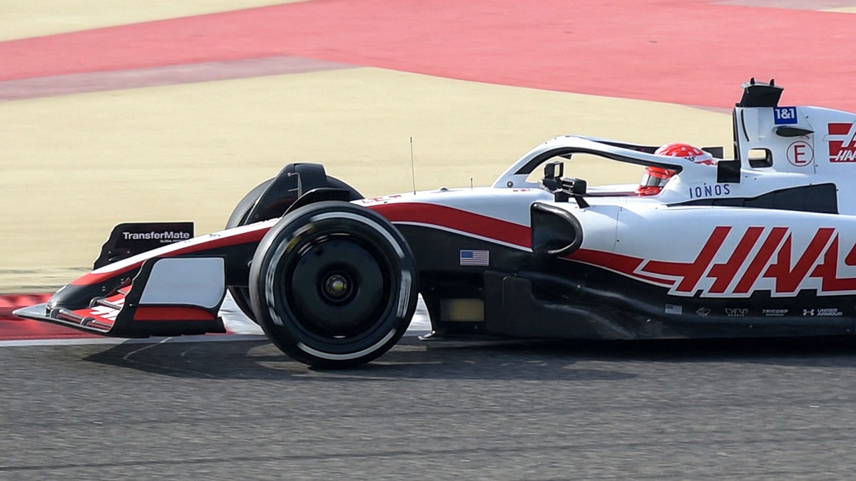 The latest version of the Haas F1 car has American flags located behind the front wheels.