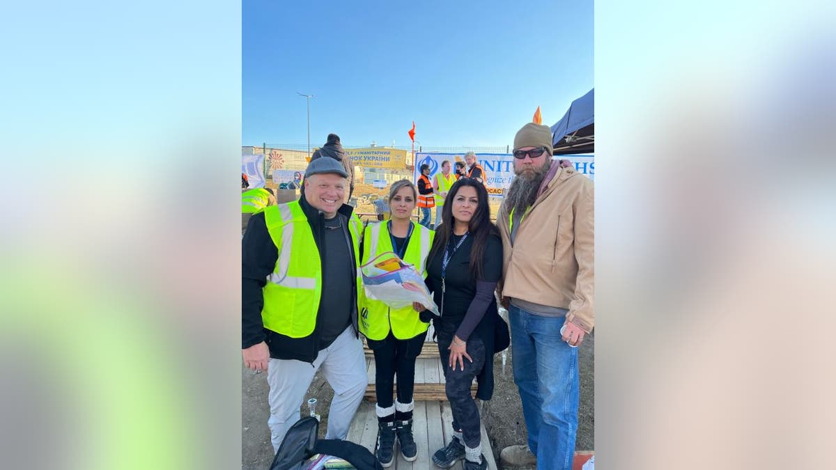 Utah restaurateur Dirk Astle (first on the left) took time off from his work to hand-deliver letters and essential relief goods to refugees at the Poland-Ukraine border.