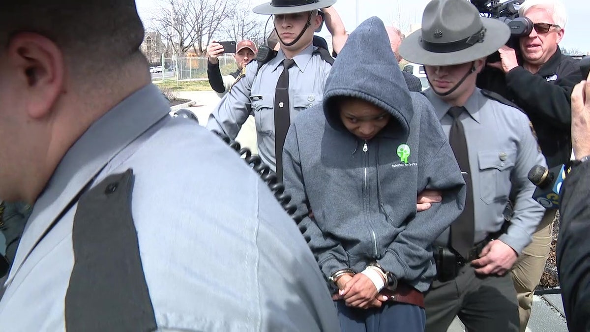 Jayana Webb in handcuffs