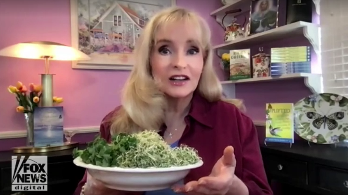 Health expert Susan Smith Jones, PhD, holds a plate of sprouts grown in her kitchen, on Tuesday, March 22, 2022. (Fox News Digital)