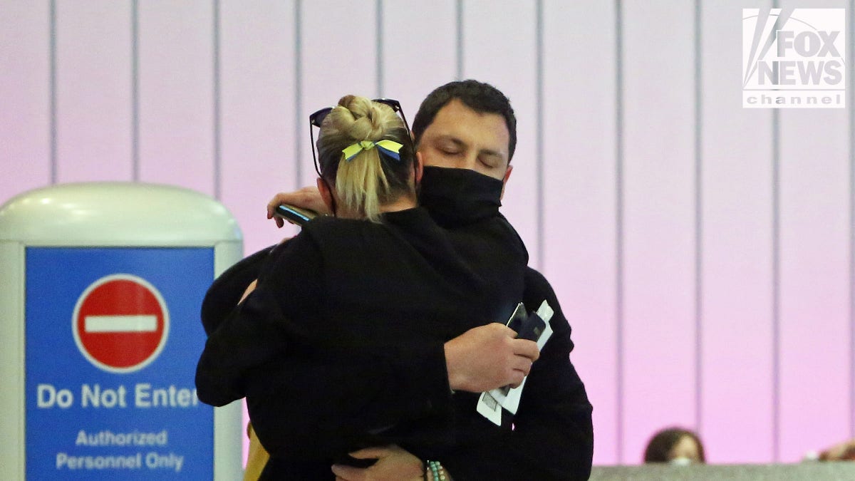 Maksim Chmerkovskiy and Peta Murgatroyd embrace