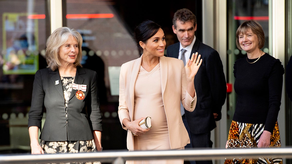 Meghan, Duchess of Sussex waves after visiting the National theatre in central London on January 30, 2019 after it was announced that she would be Patron of the theatre.?