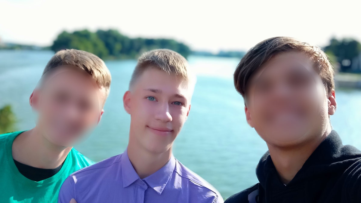 Matthew Frantsuzhan, who is studying music in Iowa, is shown in a picture with two friends from Ukraine.